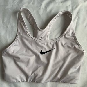 White Nike sports bra with paw print